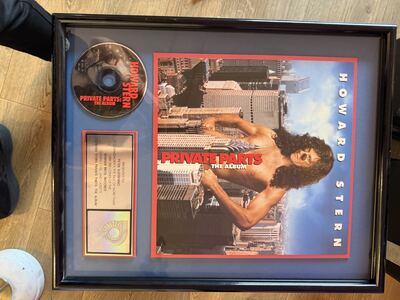Item 12: framed Howard Stern Private Parts platinum sales award